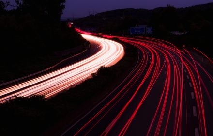 Dramatic long exposure photo of highway light trails at night near Niederdorla, Germany.