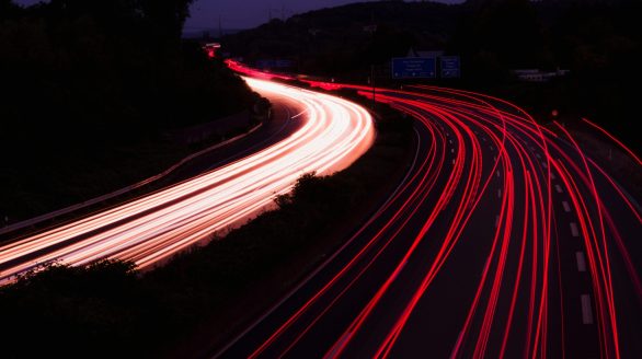 Dramatic long exposure photo of highway light trails at night near Niederdorla, Germany.